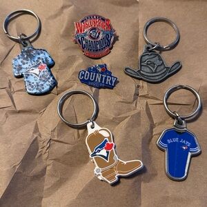 Set of various Toronto Blue Jays keychains and pins